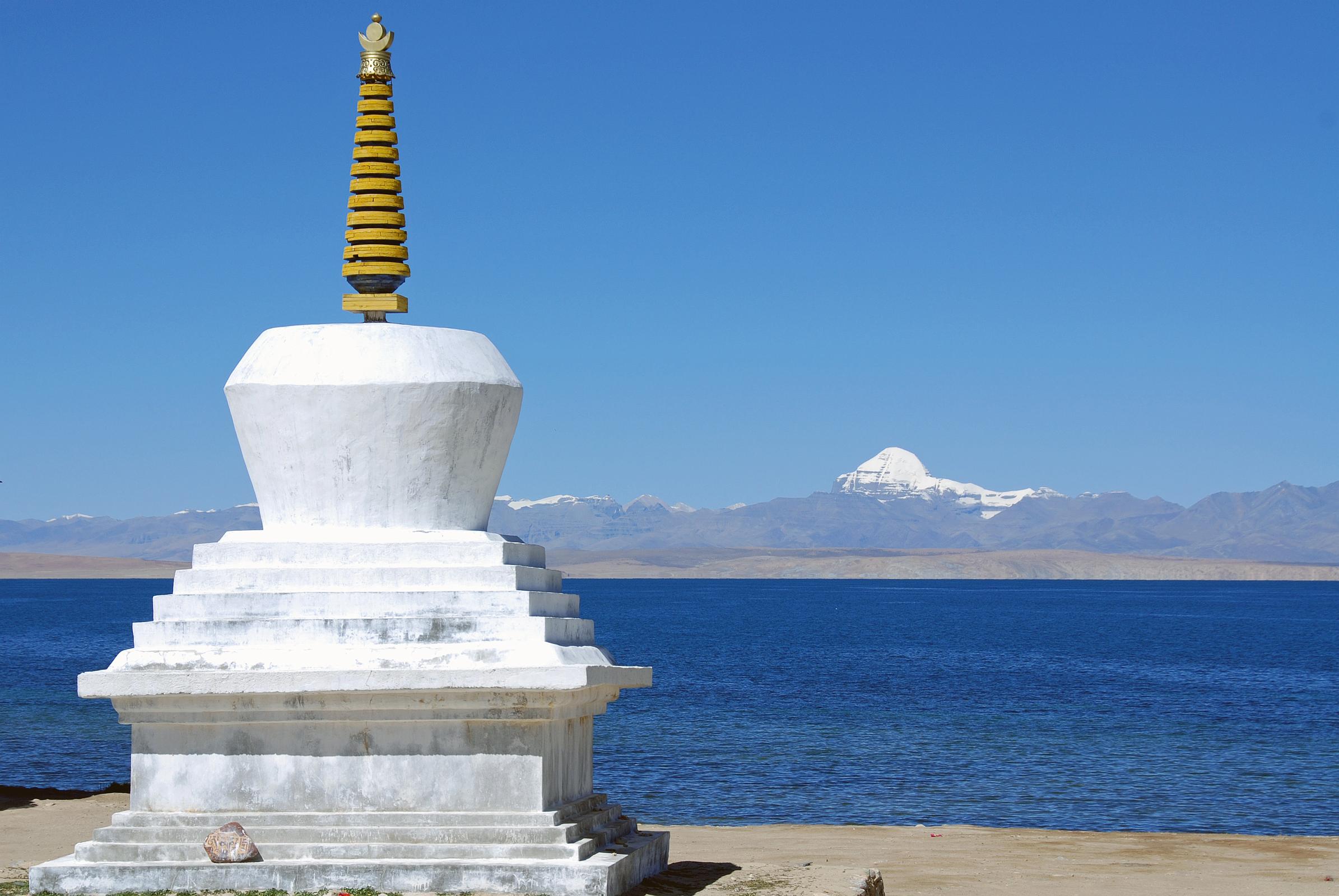 20 Trugo Gompa Chorten With Lake Manasarovar And Mount Kailash The chorten next to Trugo Gompa has a great view of Mount Kailash across Lake Manasarovar.